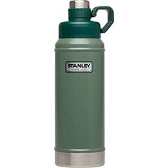 the stanley stainless steel water bottle is green and has a handle on it's side