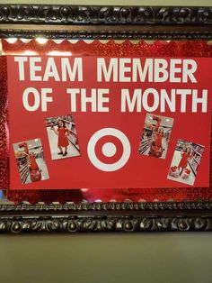 a red sign that says team member of the month with pictures of people around it