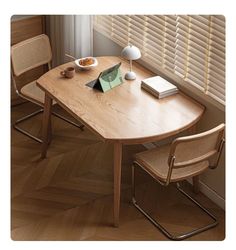 a wooden table with two chairs and a bowl of food on top of the table