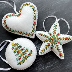 three ornaments made to look like hearts and stars