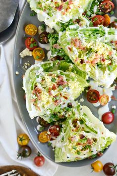 lettuce wraps with tomatoes and cheese on a plate