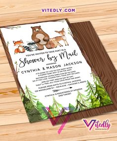 an animal themed baby shower is shown on a wooden background with the words, you're