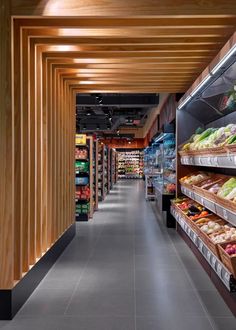 an empty grocery store filled with lots of fresh produce and vegetables on shelves next to each other