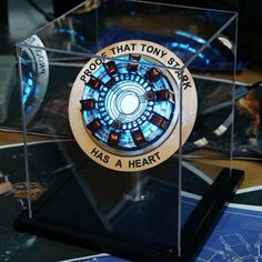 a glass display case with the iron man symbol on it