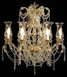 a fancy chandelier with many lights on the bottom and one light above it