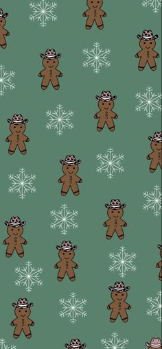 a green background with brown teddy bears and snowflakes