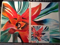 an open notebook with two pictures of flowers and leaves painted on the pages in different colors