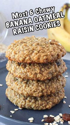 three oatmeal raisin cookies stacked on top of each other with bananas in the background