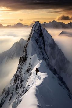 a man standing on top of a snow covered mountain