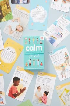 the children's book called calm is surrounded by cards and magnets on a blue surface