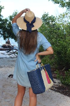 This over-sized straw tote is your go-to carryall for Saturday morning farmer's markets, family beach days or completing the perfect linen suit. Topped with ornamental wrapped handles and suede tassels, it is completed by a classic linen interior lining. This navy and natural structured tote feels modern and bohemian at once. Content:- Paper Straw- Linen Lining- Suede- Imported Size:- Width: 22" - Height: 12"- Depth: 6"- Handle Drop: 3.5" Bohemian Beach Bag With Leather Handles For Summer, Bohemian Summer Beach Bag With Leather Handles, Blue Handwoven Straw Bag For Beach Season, Chic Blue Handwoven Straw Bag, Summer Beach Tote Bag, Woven Jute Straw Bag For Summer Outings, Handwoven Natural Bags For Summer Outings, Natural Handwoven Straw Bag For Summer Outings, Chic Straw Beach Bag For Summer Outings