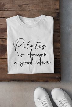 a t - shirt that says pilates is always a good idea on it