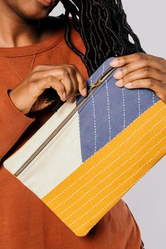 The perfect clutch for your everyday essentials. Showcasing a bold color block pattern and charming embroidered details, this oversized clutch is sure to become your go-to accessory. Use this zippered pouch as a clutch during a night out or as a sleeve to transport your laptop to and from work. #anchalproject #fairtrade #designingchange #artisanmade #ethicaldesign #sustainableliving #sustainabletravel #carbonfootprint Clutch Pouch, Block Pattern