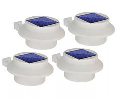 four white solar powered motion sensor lights