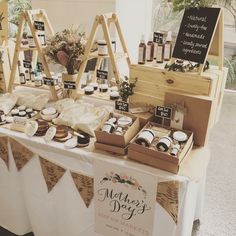 there are many items on the table at this wedding reception, including cookies and pies