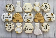 decorated cookies are arranged in the shape of bride and groom's dresses, shoes, and bouquets