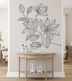 a wall decal with flowers on it in the corner of a dining room area