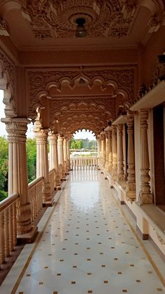 an ornate balcony with columns and pillars