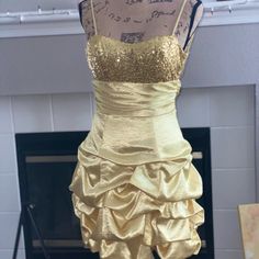 Adorable Gold Dress With Sequin Design! Only Worn Once But Looks Brand New. No Stains Or Tears. Zipper Works Fine, It Doesn’t Zip All The Way Up In Pic Because It’s Smaller Than Mannequin. Feel Free To Send Offers! Fitted Yellow Dress For Homecoming, Yellow Fitted Dress For Homecoming, Fitted Yellow Homecoming Dress, Gold Dama Dresses, Formal Gold Dress, Gold Backless Dress, White Dress With Gold, Backless Dress Short, Short Formal Dress