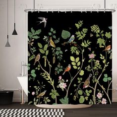 a black shower curtain with birds and flowers on it