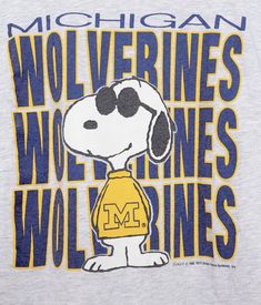 a t - shirt that says wolverines with a dog on it