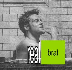 black and white photo of man in bathtub with green rectangle sign reading real