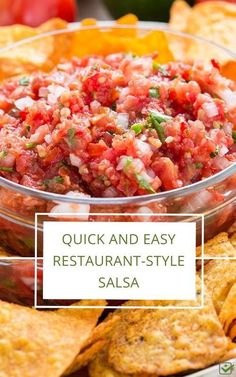 a bowl filled with salsa surrounded by tortilla chips