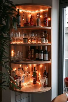 a shelf filled with lots of bottles and glasses