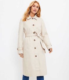 Perpetually polished style, but make it flirty - this swingy trench is tailored perfection that flutters, flows, and freshes up every routine. Point collar. Button front. Long sleeves with button tabs. Tie belt. Front welt pockets. Back vent. Loft Petite Swing Trench Coat Size 2XL Almondine Women's by Loft Size Petite - 2XL Almondine Women's Outerwear, Jackets, 100%, Cotton, Lining:, 100%, Polyester, Machine, Washable Dark Green Coat, Black Raincoat, Rain Trench Coat, Lightweight Trench Coat, Pink Trench Coat, Heavy Coat, Spring Coat, Houndstooth Dress, Tweed Coat