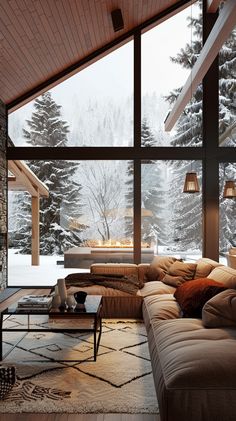 a living room filled with lots of furniture next to a large window covered in snow