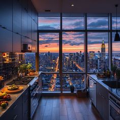 a kitchen filled with lots of counter top space next to a window covered in city lights