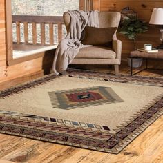 a living room area with a chair and rug