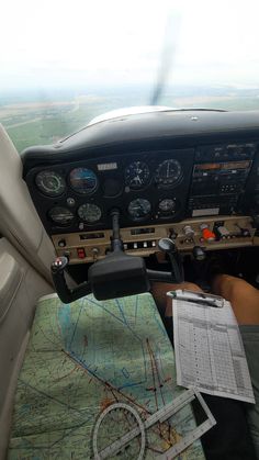 the view from inside an airplane looking down at the cockpit and instrument controls on the map