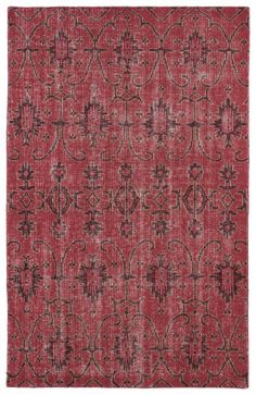 a red rug with an intricate design on it