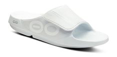 An evolution of the OOriginal, featuring an agile OOfoam™ strap for additionalsupport and comfort. Sport Flex: A contemporary spin on the classic slide, with a sleek adjustable upperstrap for a more optimal all-around fit. | OOFOS Women's OOahh Sport Flex Recovery Sandal Size 16 in White Recovery Sandals, Active Recovery, Black Clogs, Closed Cell Foam, Size 13, Black Shoes, Evolution, Size 16, White And Black