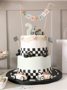 a black and white cake sitting on top of a table