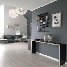 a living room with grey walls and white flooring