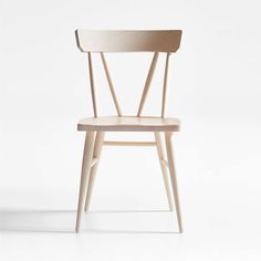 a wooden chair on a white background with the seat up and one arm extended to the side