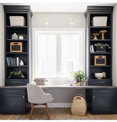 a home office with built in bookshelves and desk, along with a wicker basket on the floor