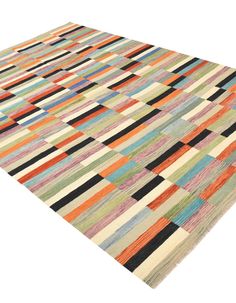 a multicolored area rug on white background