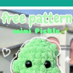 a green stuffed animal with the words free pattern on it's face and eyes