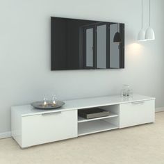 a white entertainment center with two mirrors on the wall