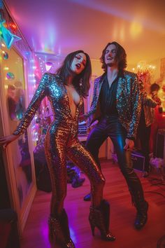 two people dressed in sequins dancing on the dance floor at a disco party