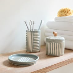 bathroom accessories displayed on shelf in white room