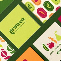 several business cards with different logos on them, all in green and orange colors together