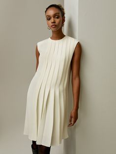 Elegantly crafted sleeveless accordion pleated silk dress in luxurious 100% silk fabric. Perfect for any special occasion, available in various colors. A-line Pleated Dress With Pleated Hem For Evening, Fitted A-line Dress With Accordion Pleats, Formal A-line Dress With Folds, Elegant A-line Dress With Folds, Spring Pleated Pre-draped Midi Dress, Evening A-line Pleated Dress With Accordion Pleats, Evening A-line Dress With Pleated Back, Silk A-line Dress With Pleated Bodice, Chic A-line Dress With Pleated Waist