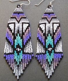 two pairs of beaded earrings are shown on a gray surface, one is purple and the other is blue