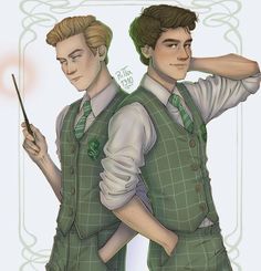 two young men are dressed in green vests and ties, one is holding a wand