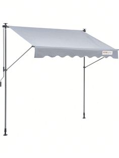 a white tent with an awning attached to it