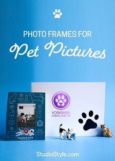 White photo folder with black paw print and purple animal shelter logo. Next to it is a blue Instax paper frame for an animal feed store. Paper Photo Frame, Pet Picture, Personalized Photo Frames, Pet Photos